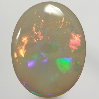 SOLID SEMI BLACK OPAL  Very bright fire in a Flag Harlequin pattern. SEE VIDEO